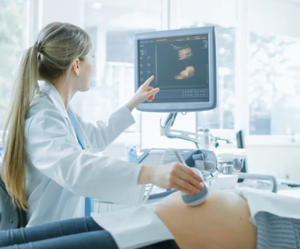 Doctor sonographer checking patient modern ultrasound scanner